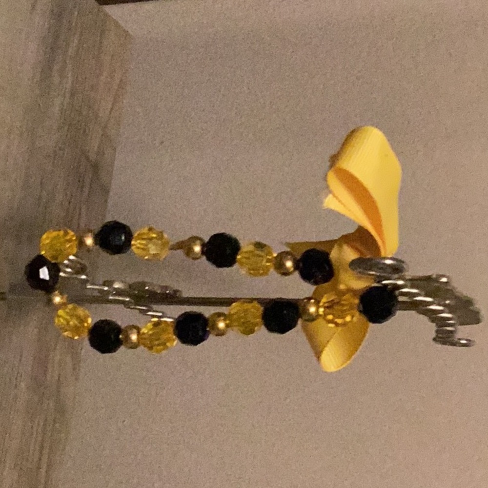 Handmade luxury beaded black and yellow bracelet.